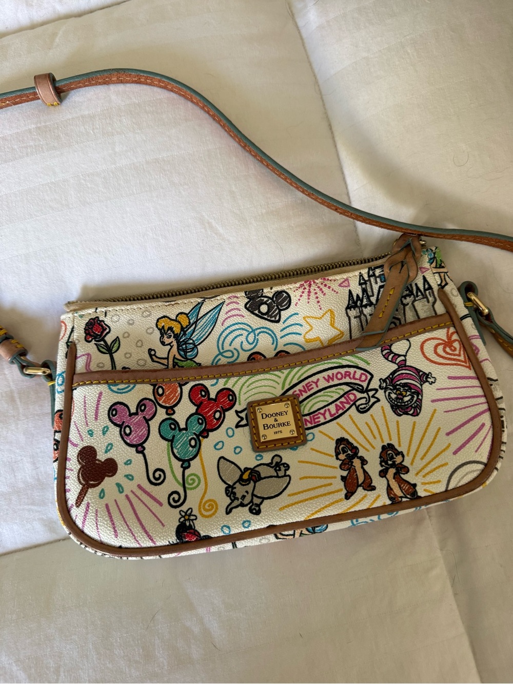Dooney & Bourke Cream Disney Character Print Crossbody Bag with Tan Trim